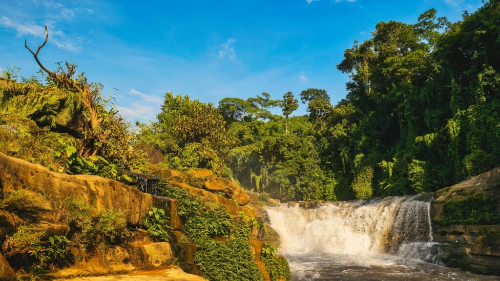 Beautiful view of Nafa-Khum waterfall surrounded by lush greenery in Bandarban, Bangladesh.